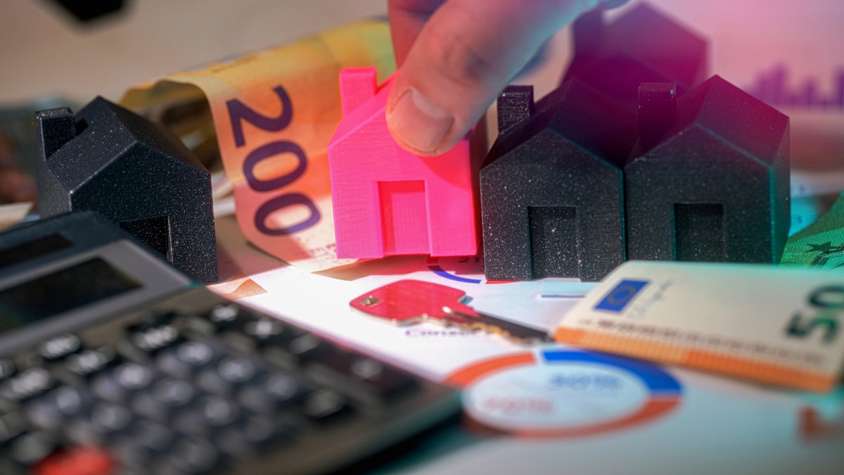 Real estate investment — euro banknotes and miniature houses