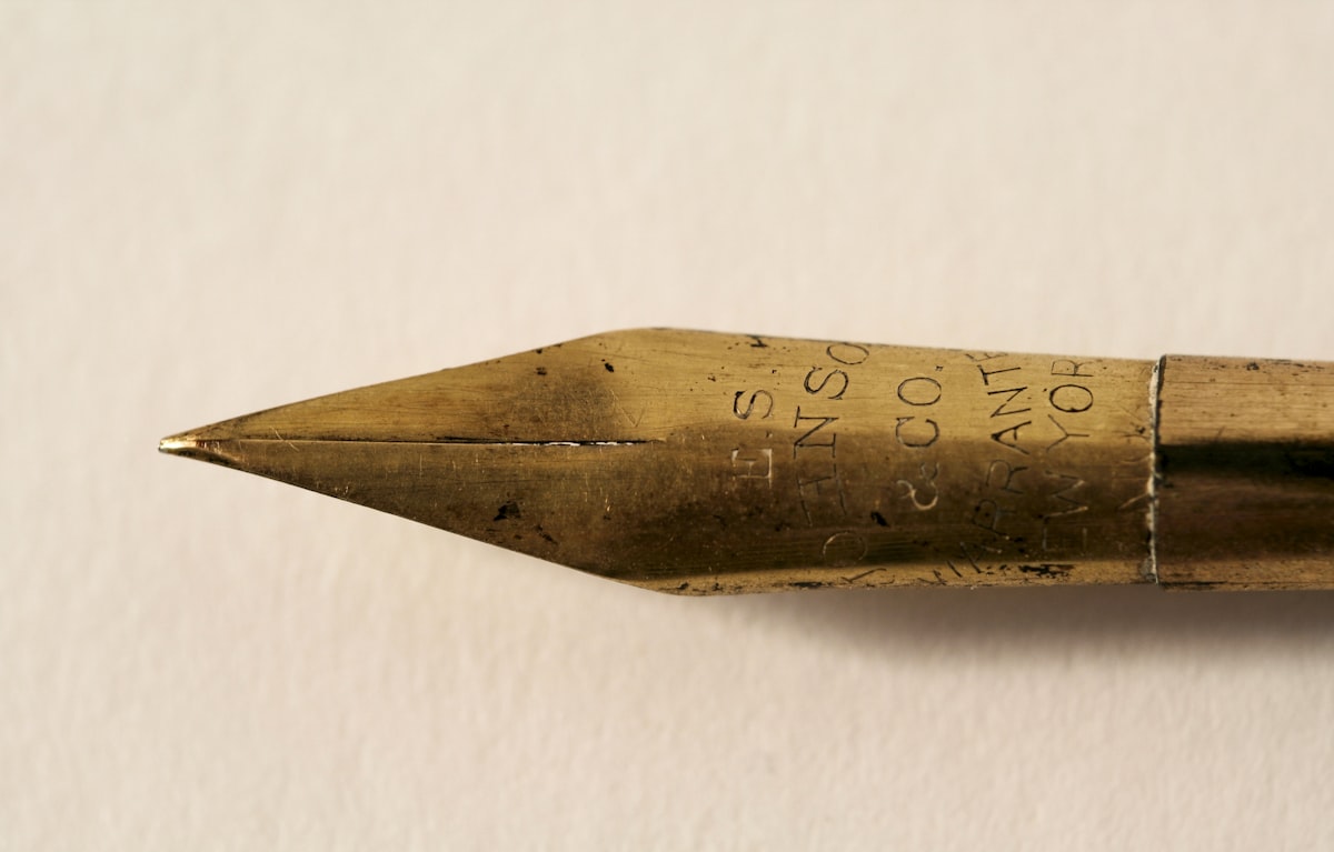 Gold fountain pen on a contract document